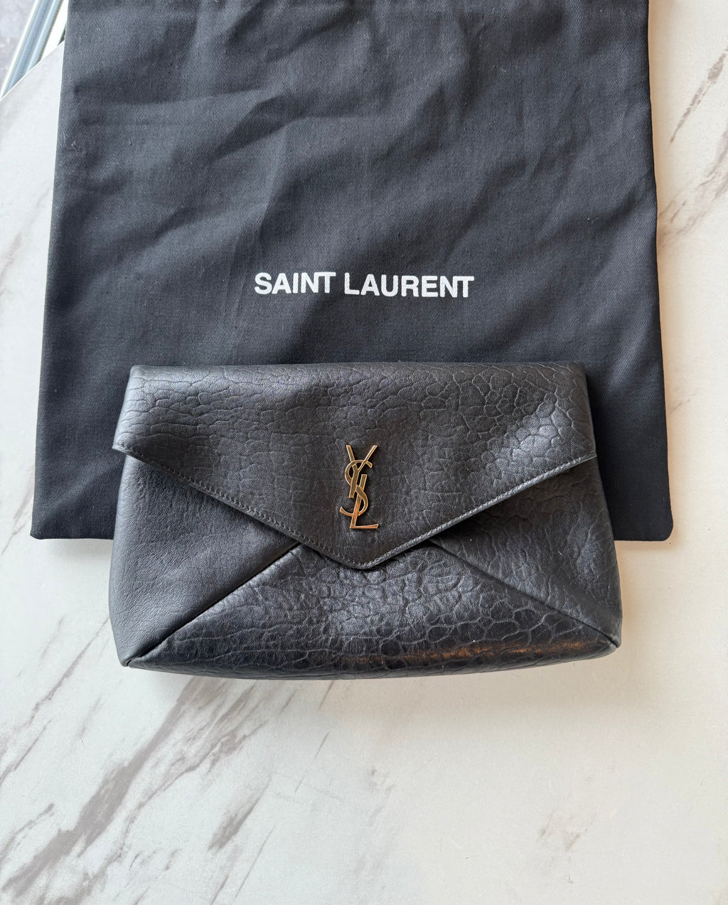 YSL Cassandre large textured-leather clutch