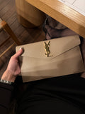 UPTOWN POUCH IN GRAIN DE POUDRE LEATHER BEIGE
